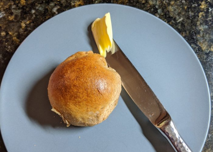 Spelt rolls with butter knife for scale